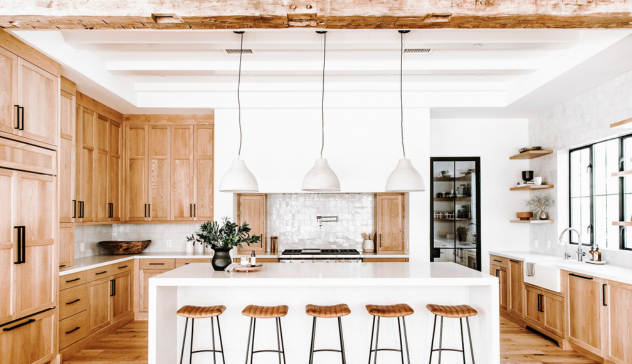 Farmhouse Kitchen A cozy kitchen featuring solid wood shaker cabinets, open shelving, and stainless-steel appliances that merge rustic warmth with modern efficiency.