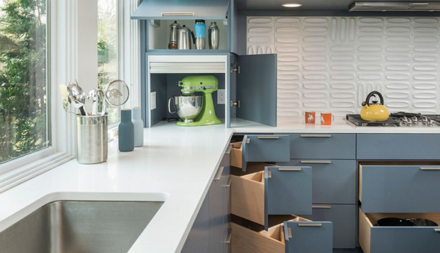 A visual of corner cabinets with rotating trays (Lazy Susans), tiered spice racks, and pullout trash bins integrated into lower cabinets. Use soft lighting to emphasize organized modular inserts made of moisture-resistant plywood or bamboo.